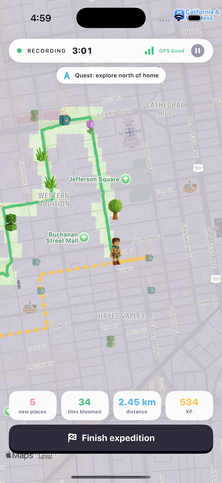 PathBloom map mid-walk: the streets already walked have bloomed into green voxel trees and flowers, unexplored streets are still gray